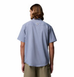 a man wearing a purple Skiff Guide II Short Sleeve Shirt