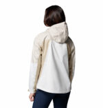 a women wearing a beige Inner Limits IV Jacket