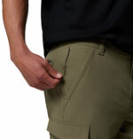 a man wearing green ROC Tech Cargo Shorts