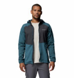 a man wearing a blue Columbia Tech II Windbreaker