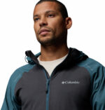 a man wearing a blue Columbia Tech II Windbreaker