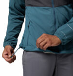 a man wearing a blue Columbia Tech II Windbreaker