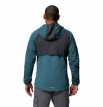 a man wearing a blue Columbia Tech II Windbreaker