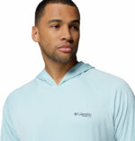 a man wearing a blue PFG Terminal Tackle Hoodie