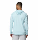 a man wearing a blue PFG Terminal Tackle Hoodie