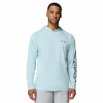 a man wearing a blue PFG Terminal Tackle Hoodie