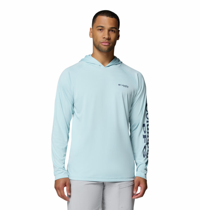 a man wearing a blue PFG Terminal Tackle Hoodie