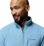 a man wearing a Fast Trek II Full Zip Fleece Jacket