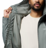 a man wearing a Inner Limits III Rain Jacket
