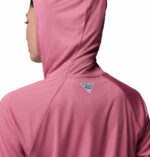 a women wearing a PFG Tidal Tee II Hoodie
