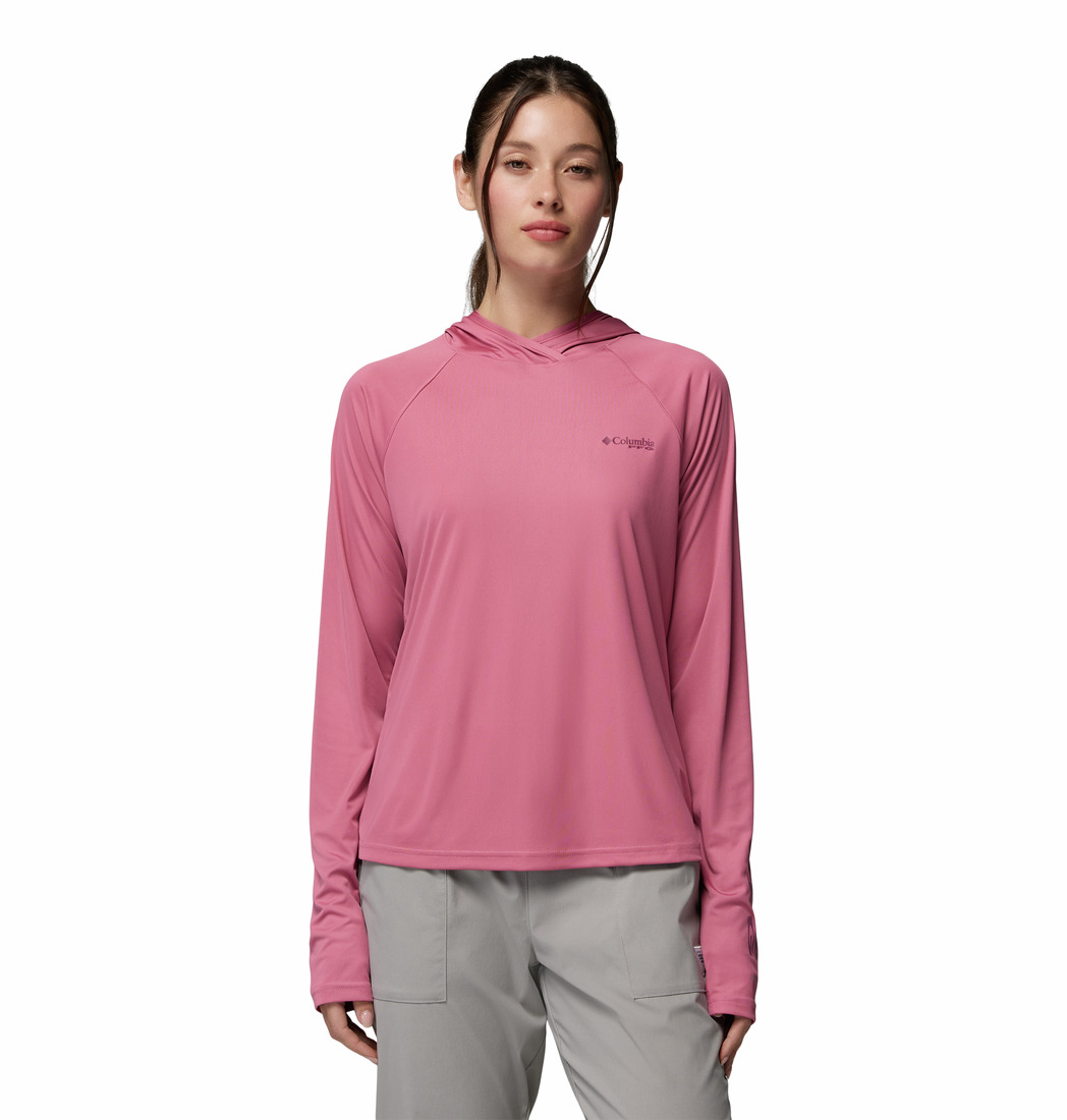 a women wearing a PFG Tidal Tee II Hoodie