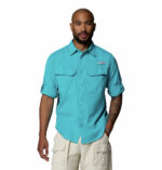 a man wearing a Skiff Guide II Long Sleeve Shirt