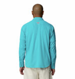 a man wearing a Skiff Guide II Long Sleeve Shirt