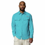a man wearing a Skiff Guide II Long Sleeve Shirt