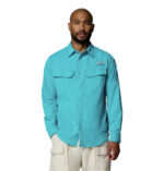 a man wearing a Skiff Guide II Long Sleeve Shirt